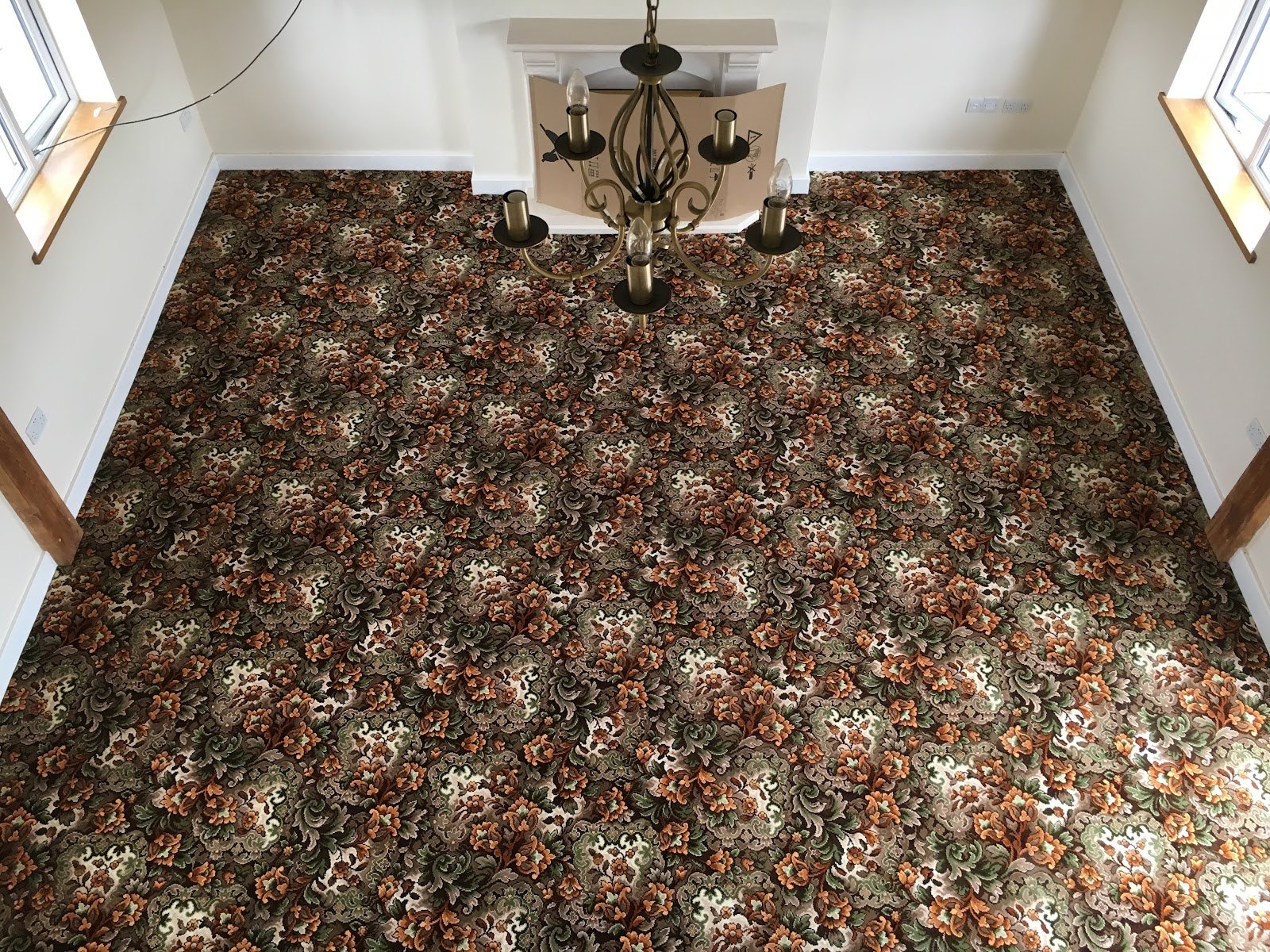 Floral patterned carpet fitted across a large room